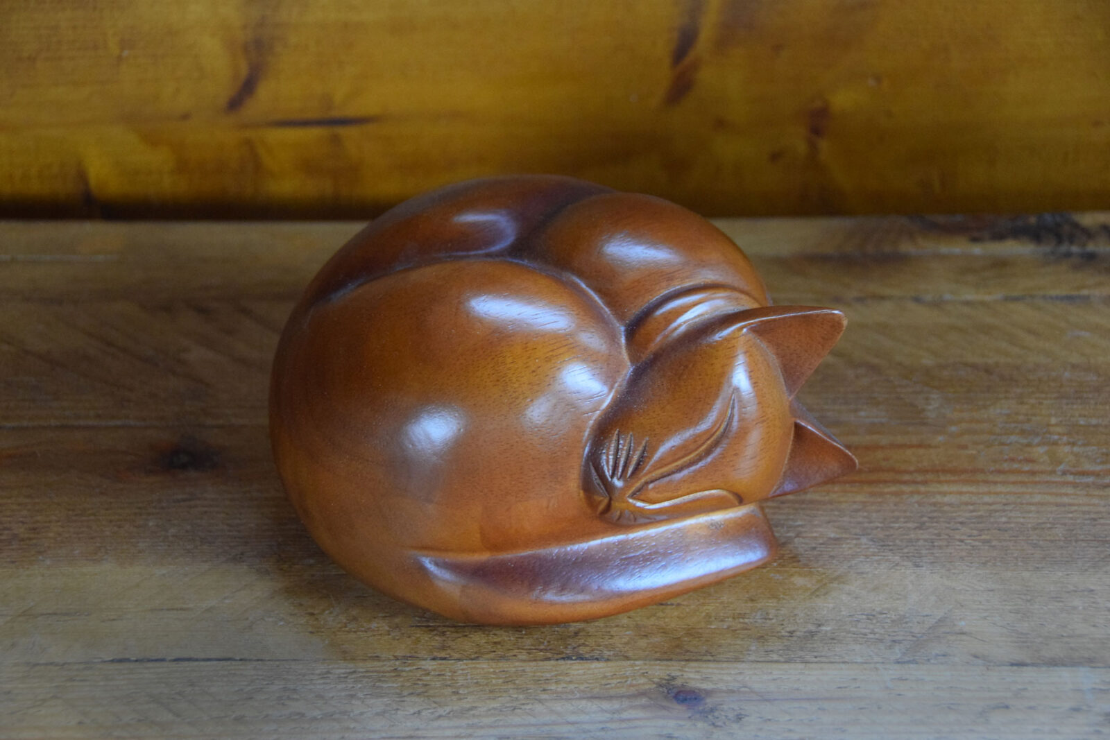 Wooden sleeping cat